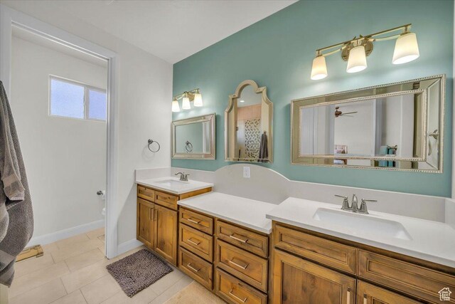 875 E Roadrunner Dr, Washington, UT 84780 - full bath with double vanity, ceiling fan, tile patterned flooring, and a sink