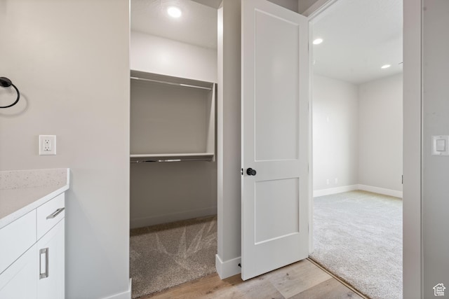 1516 W 800th Cir S, Hurricane, UT 84737 - bathroom featuring baseboards, wood finished floors, recessed lighting, vanity, and a walk in closet