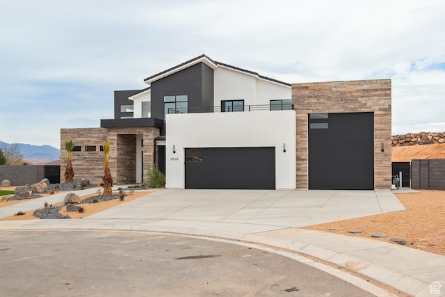1516 W 800th Cir S, Hurricane, UT 84737 - modern home featuring a balcony, stucco siding, stone siding, and concrete driveway