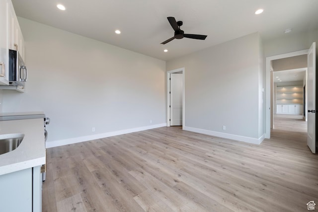 1516 W 800th Cir S, Hurricane, UT 84737 - interior space with white cabinetry, recessed lighting, stainless steel microwave, light wood finished floors, and ceiling fan