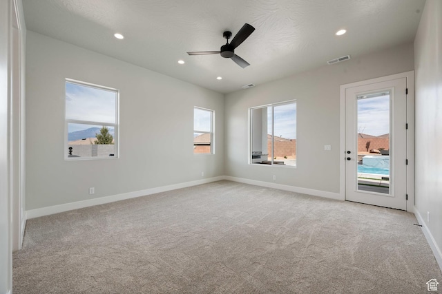 1516 W 800th Cir S, Hurricane, UT 84737 - spare room featuring light carpet, visible vents, and recessed lighting