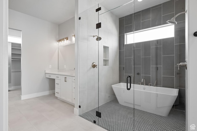 1516 W 800th Cir S, Hurricane, UT 84737 - bathroom featuring tile patterned flooring, vanity, a freestanding tub, baseboards, and a shower stall