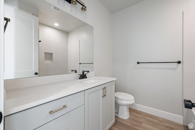 1516 W 800th Cir S, Hurricane, UT 84737 - bathroom featuring visible vents, baseboards, toilet, wood finished floors, and vanity