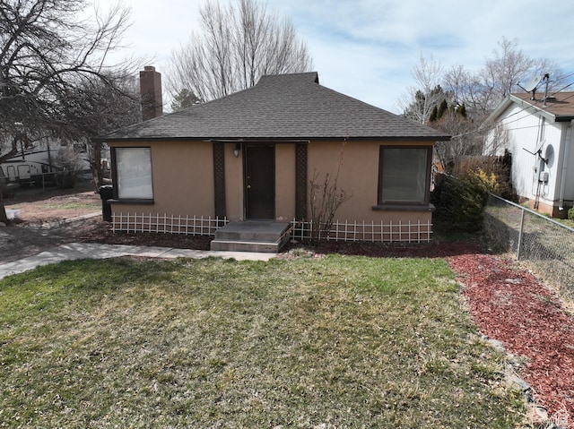 bungalow with roof with shingles, a chimney, stucco siding, fence, and a front lawn