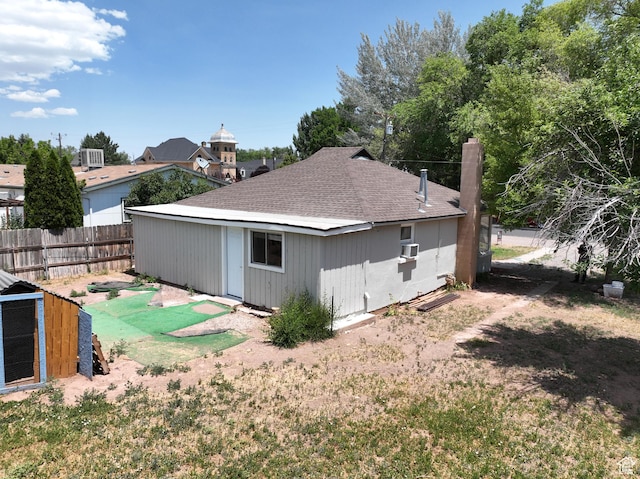 440 S 200 W, Richfield, UT 84701 - rear view of house with a chimney, roof with shingles, and cooling unit