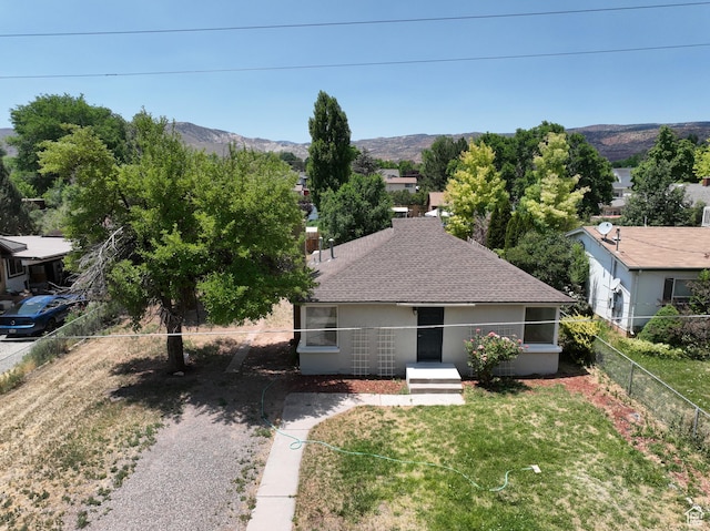 440 S 200 W, Richfield, UT 84701 - view of front facade with roof with shingles, a mountain view, and stucco siding