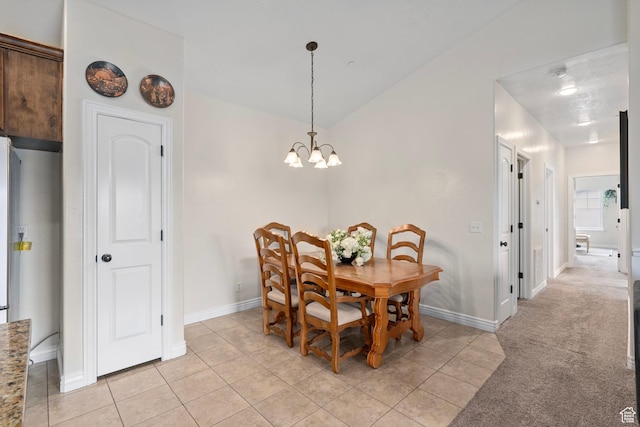 343 S 790 W Unit 301, Pleasant Grove, UT 84062 - dining area featuring light colored carpet, baseboards, light tile patterned floors, and a chandelier