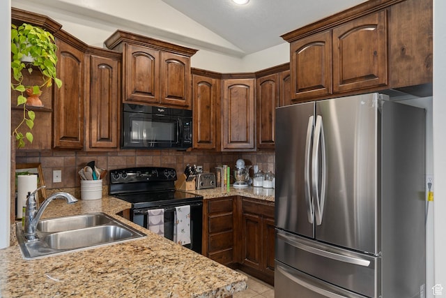 343 S 790 W Unit 301, Pleasant Grove, UT 84062 - kitchen with tasteful backsplash, vaulted ceiling, light tile patterned floors, a sink, and black appliances