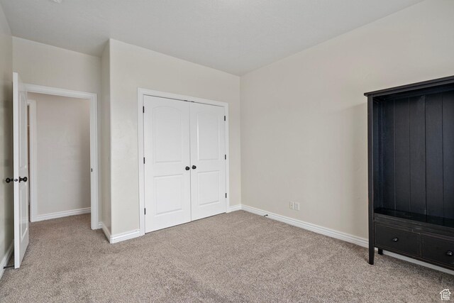 343 S 790 W Unit 301, Pleasant Grove, UT 84062 - unfurnished bedroom with a closet, baseboards, and light colored carpet
