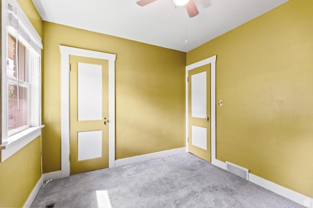 325 E 300 S, Logan, UT 84321 - empty room featuring carpet, a ceiling fan, and baseboards