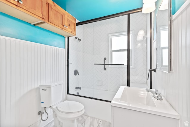 325 E 300 S, Logan, UT 84321 - bathroom featuring a sink, toilet, and bath / shower combo with glass door