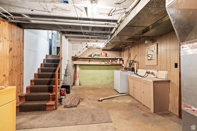 325 E 300 S, Logan, UT 84321 - unfinished below grade area with washer / clothes dryer, wood walls, and stairway