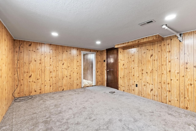 325 E 300 S, Logan, UT 84321 - carpeted spare room featuring wooden walls, recessed lighting, and a textured ceiling