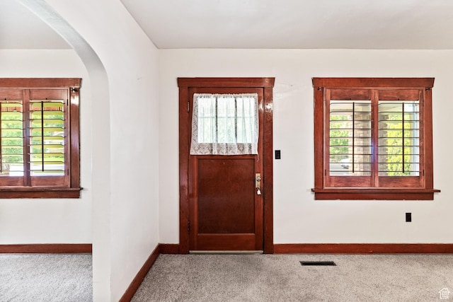 325 E 300 S, Logan, UT 84321 - carpeted entryway with arched walkways, baseboards, and healthy amount of natural light