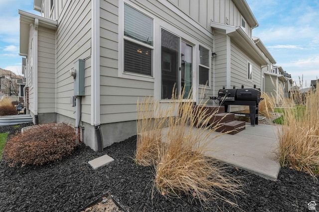 15226 S Glory Dr W, Bluffdale, UT 84065 - view of home's exterior with board and batten siding and a patio area