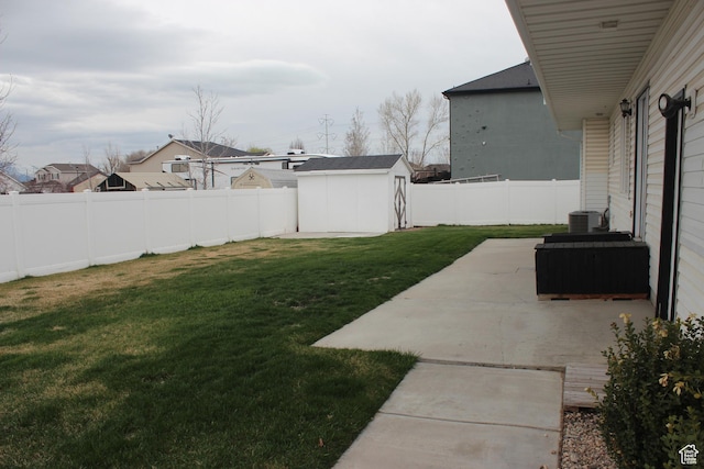 987 S 790 W, Lehi, UT 84043 - view of yard featuring central air condition unit, a storage shed, a fenced backyard, an outbuilding, and a patio area