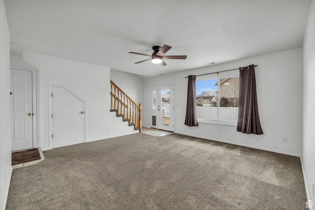 987 S 790 W, Lehi, UT 84043 - unfurnished living room with baseboards, stairs, ceiling fan, and carpet