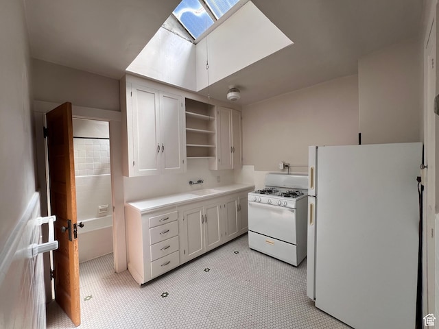 240 N Spencer Ct, Salt Lake City, UT 84103 - kitchen with light countertops, a skylight, white appliances, a sink, and open shelves