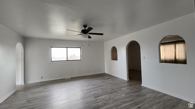 84 N 550 E, Spring City, UT 84662 - spare room with arched walkways, baseboards, ceiling fan, and wood finished floors