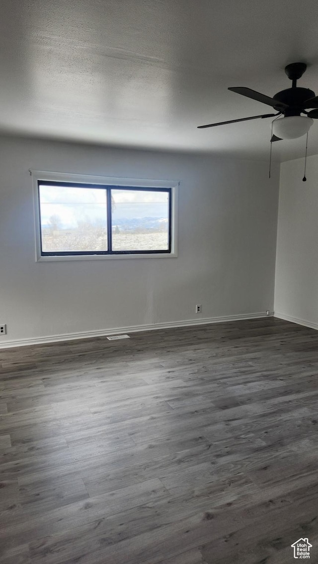 84 N 550 E, Spring City, UT 84662 - empty room with a ceiling fan, dark wood-type flooring, and a wealth of natural light