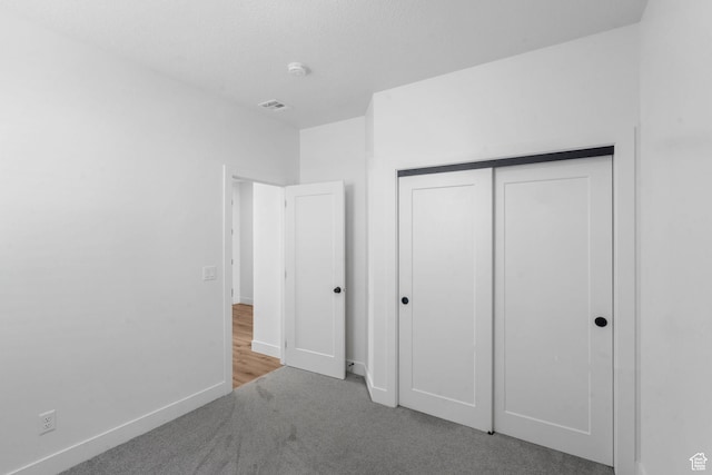 2841 N Rosie Loop N, Cedar City, UT 84721 - unfurnished bedroom with baseboards, visible vents, a closet, and carpet