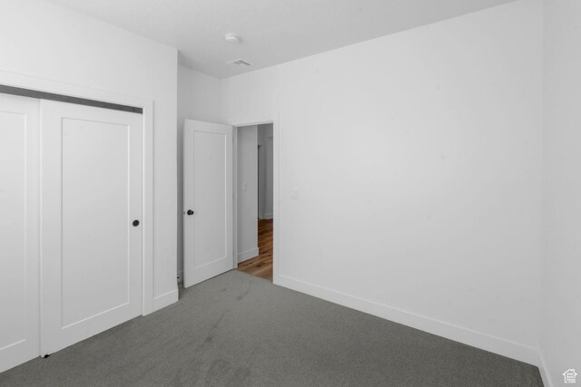 2841 N Rosie Loop N, Cedar City, UT 84721 - unfurnished bedroom with a closet, carpet, baseboards, and visible vents