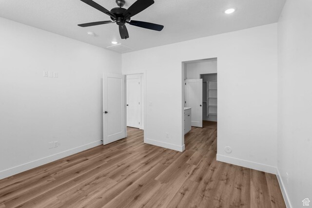2841 N Rosie Loop N, Cedar City, UT 84721 - unfurnished bedroom featuring baseboards, light wood-type flooring, recessed lighting, and a ceiling fan