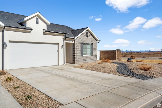 2841 N Rosie Loop N, Cedar City, UT 84721 - single story home featuring fence, a garage, stucco siding, brick siding, and driveway