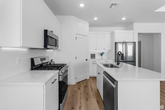 2841 N Rosie Loop N, Cedar City, UT 84721 - kitchen with light countertops, visible vents, appliances with stainless steel finishes, a sink, and light wood-style floors