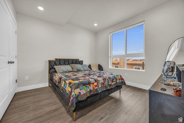 bedroom featuring recessed lighting, baseboards, and wood finished floors