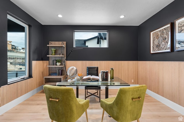 home office featuring wood finished floors, a wealth of natural light, recessed lighting, and wainscoting