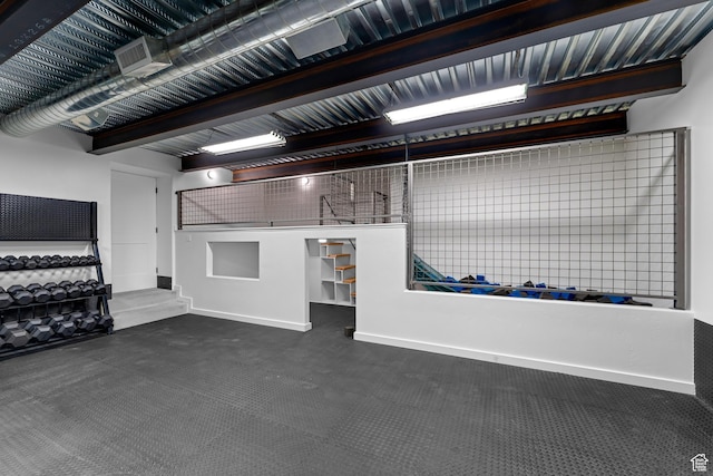 garage featuring baseboards and visible vents