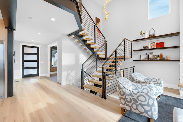 entrance foyer featuring recessed lighting, baseboards, and light wood-type flooring