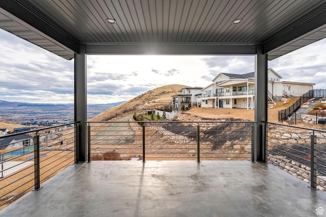 view of patio / terrace with a balcony and a mountain view