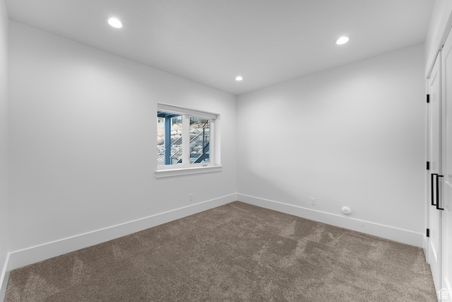 unfurnished room with baseboards, recessed lighting, and carpet flooring