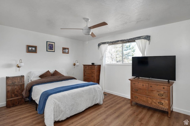 761 E Raygene Way S, North Salt Lake, UT 84054 - bedroom with a ceiling fan, a textured ceiling, baseboards, and wood finished floors