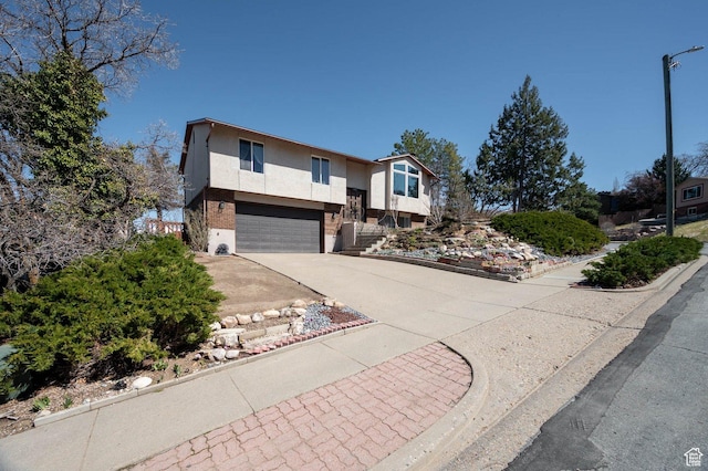 761 E Raygene Way S, North Salt Lake, UT 84054 - raised ranch with stucco siding, a garage, and concrete driveway