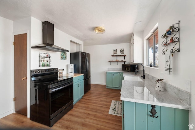 761 E Raygene Way S, North Salt Lake, UT 84054 - kitchen with wall chimney range hood, wood finished floors, a sink, open shelves, and black appliances