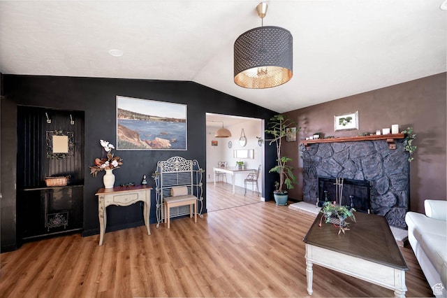 761 E Raygene Way S, North Salt Lake, UT 84054 - living area featuring a fireplace, wood finished floors, and vaulted ceiling