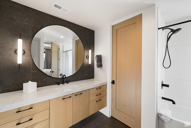 7045 E Moon Light Dr, Heber City, UT 84032 - bathroom with vanity, shower / tub combination, backsplash, and tile patterned floors