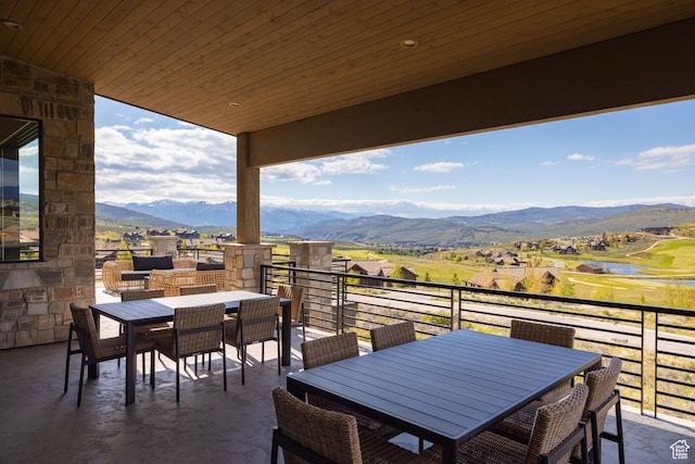 7045 E Moon Light Dr, Heber City, UT 84032 - view of patio featuring outdoor dining area, a water and mountain view, and a balcony