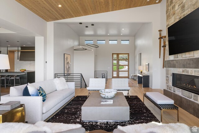 7045 E Moon Light Dr, Heber City, UT 84032 - living room featuring wood finished floors, high vaulted ceiling, wooden ceiling, recessed lighting, and a fireplace