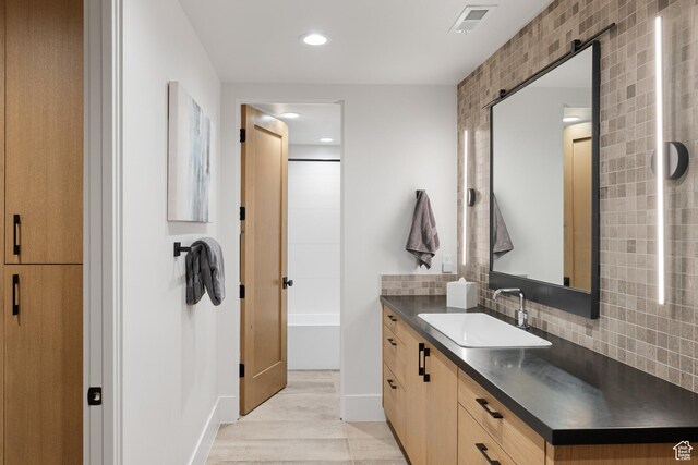 7045 E Moon Light Dr, Heber City, UT 84032 - bathroom with vanity, tasteful backsplash, recessed lighting, and wood finished floors