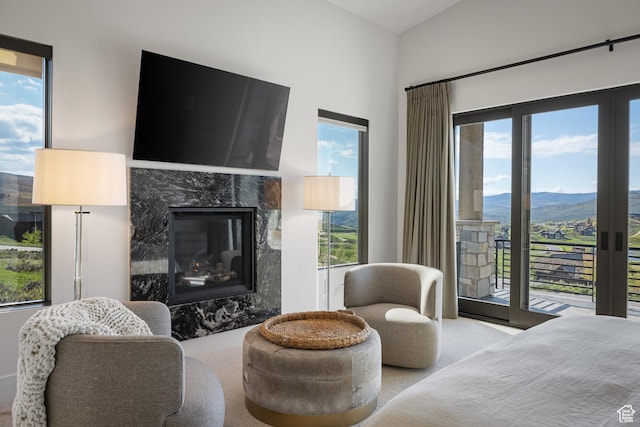7045 E Moon Light Dr, Heber City, UT 84032 - bedroom with access to outside, multiple windows, a premium fireplace, and vaulted ceiling