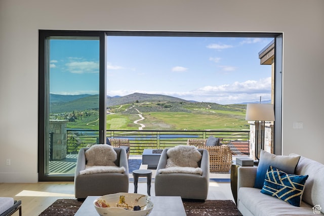 7045 E Moon Light Dr, Heber City, UT 84032 - living area featuring a mountain view, wood finished floors, and plenty of natural light