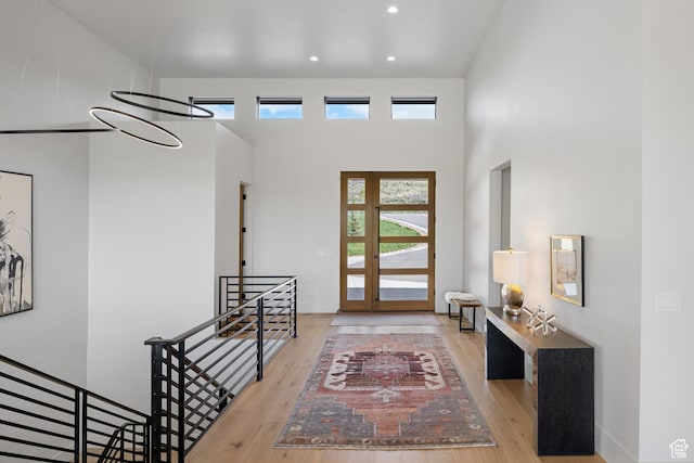 7045 E Moon Light Dr, Heber City, UT 84032 - foyer featuring wood finished floors, a towering ceiling, and recessed lighting