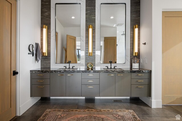 7045 E Moon Light Dr, Heber City, UT 84032 - bathroom featuring double vanity, baseboards, and tasteful backsplash
