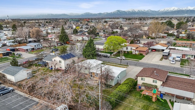 drone / aerial view featuring a residential view and a mountain view