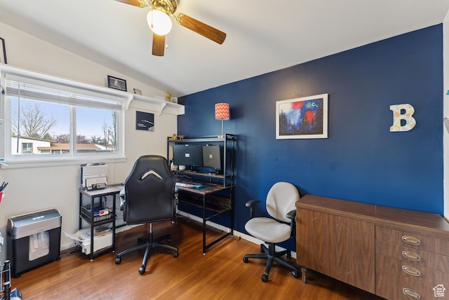 office space with a ceiling fan, lofted ceiling, and wood finished floors