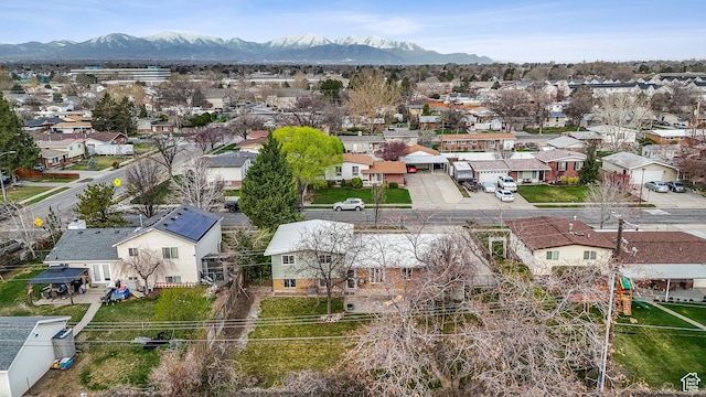 drone / aerial view featuring a mountain view and a residential view